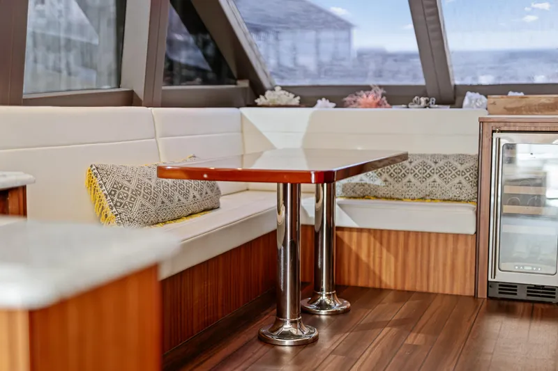 Slide: The Image of Interior of 2013 Hatteras 60 Motor Yacht with elegant seating and table. - 22