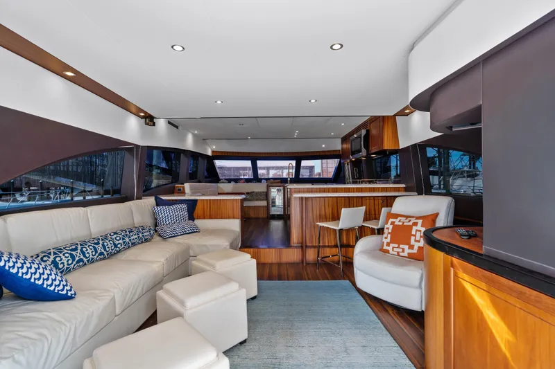 Slide: The Image of Luxurious interior of 2013 Hatteras 60 Motor Yacht with elegant seating and modern design. - 26