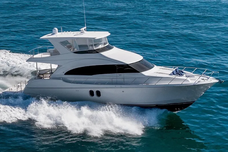 Slide: The Image of 2013 Hatteras 60 Motor Yacht cruising on open sea. - 3