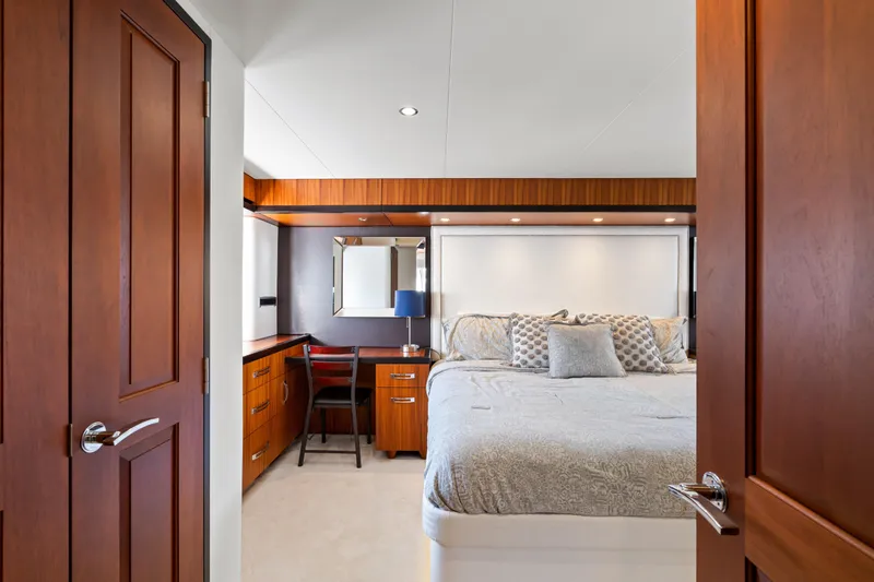Slide: The Image of Luxurious bedroom interior of 2013 Hatteras 60 Motor Yacht with elegant wood finishes. - 34