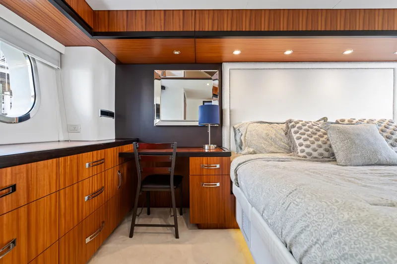 Slide: The Image of Luxurious bedroom interior of 2013 Hatteras 60 Motor Yacht with elegant wood cabinetry. - 35