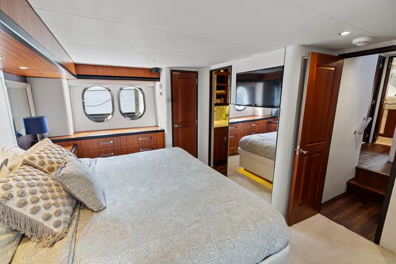 Slide: The Image of Luxurious bedroom interior of 2013 Hatteras 60 Motor Yacht with elegant wood finishes. - 38