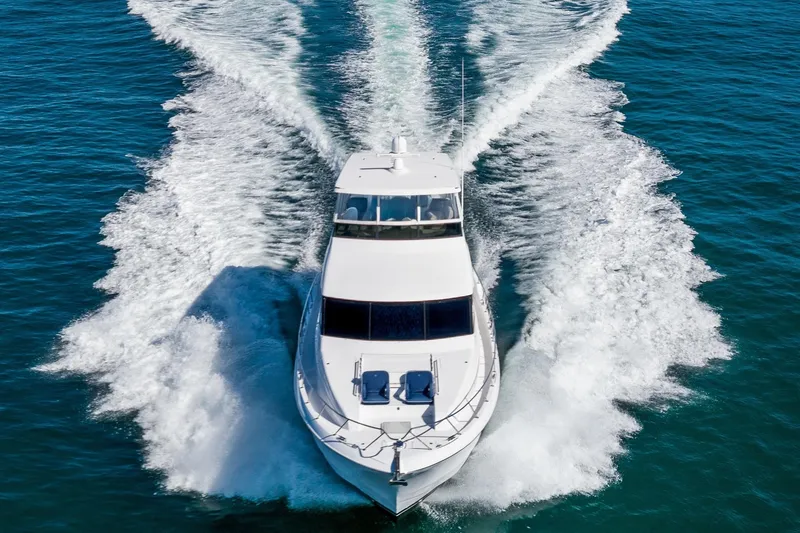 Slide: The Image of 2013 Hatteras 60 Motor Yacht cruising on open water, aerial view. - 4