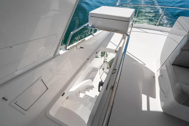 Slide: The Image of 2013 Hatteras 60 Motor Yacht deck with seating and ocean view. - 51