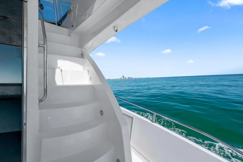 Slide: The Image of Staircase on 2013 Hatteras 60 Motor Yacht with ocean view. - 52