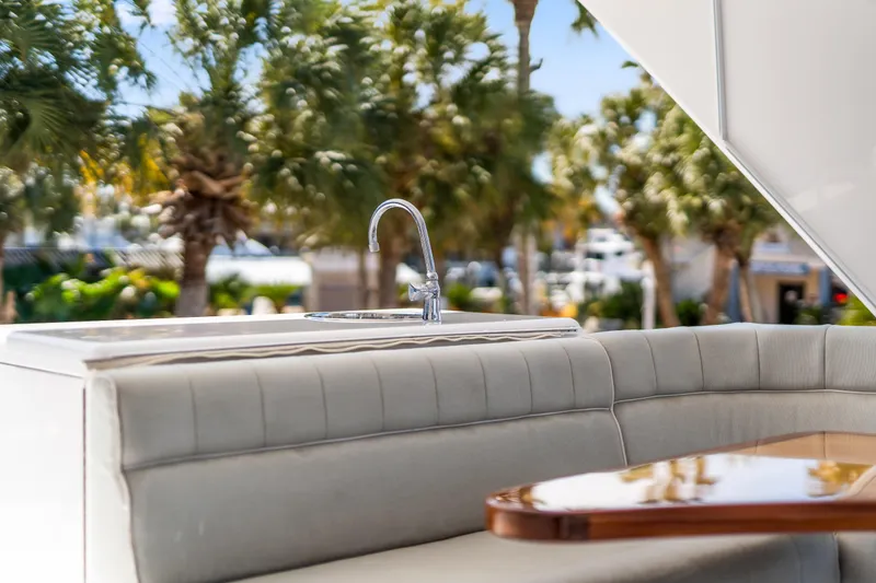 Slide: The Image of Luxurious seating area on 2013 Hatteras 60 Motor Yacht with outdoor sink. - 55