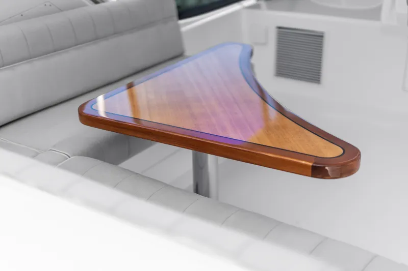 Slide: The Image of Luxurious interior of 2013 Hatteras 60 Motor Yacht with elegant wooden table. - 56