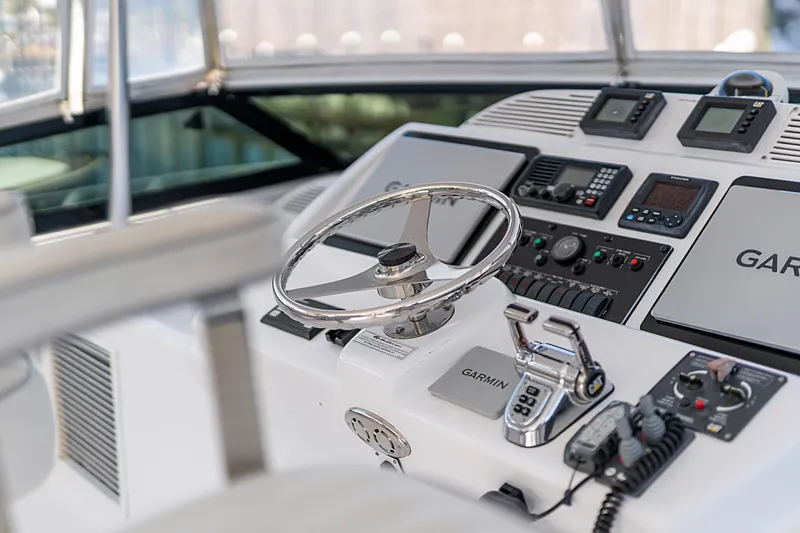 Slide: The Image of Control panel of 2013 Hatteras 60 Motor Yacht with Garmin navigation system. - 57