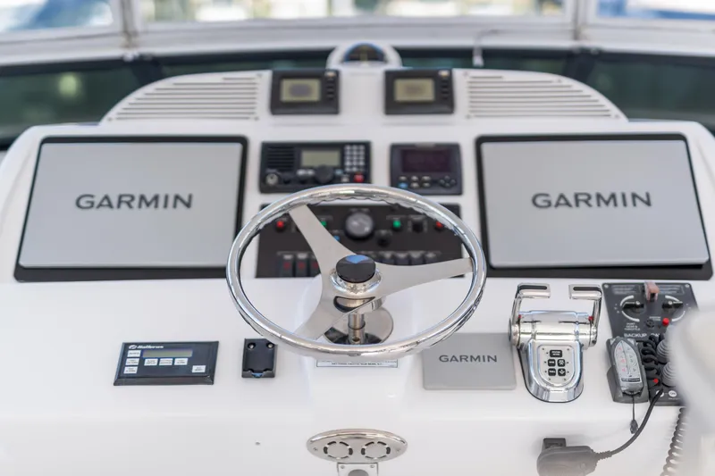 Slide: The Image of Helm of 2013 Hatteras 60 Motor Yacht with Garmin navigation systems. - 58