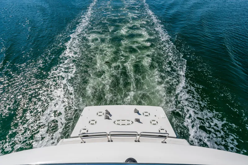 Slide: The Image of Wake trail behind 2013 Hatteras 60 Motor Yacht on open water. - 65