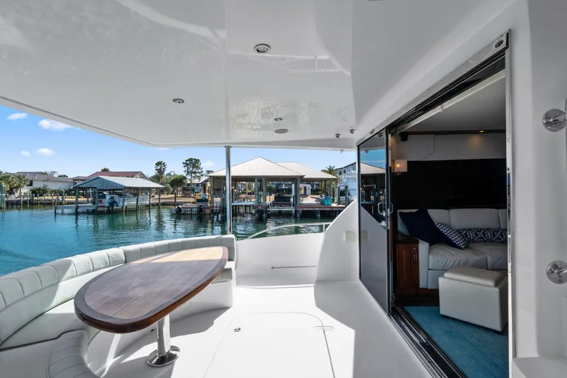 Slide: The Image of Luxurious 2013 Hatteras 60 Motor Yacht with elegant interior and scenic marina view. - 66