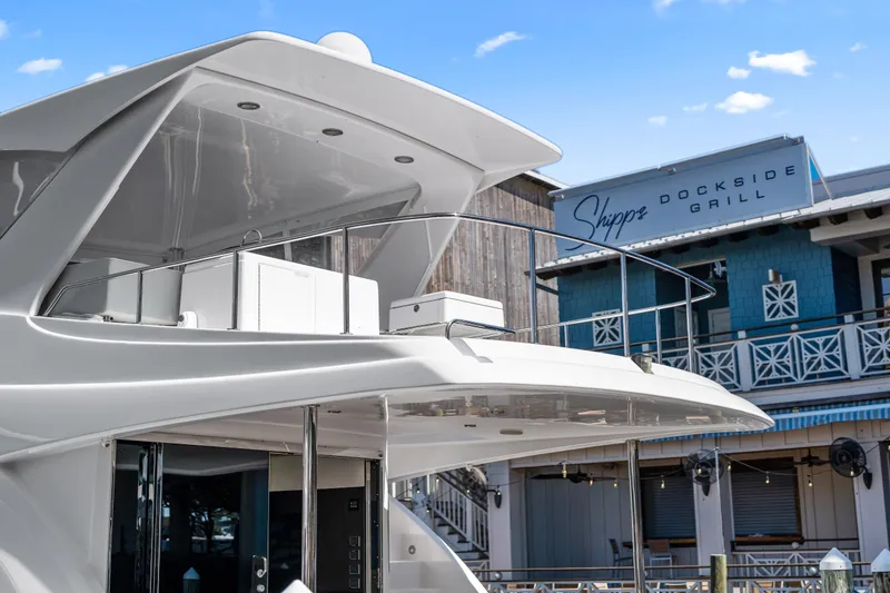 Slide: The Image of 2013 Hatteras 60 Motor Yacht docked near Shipps Dockside Grill. - 9