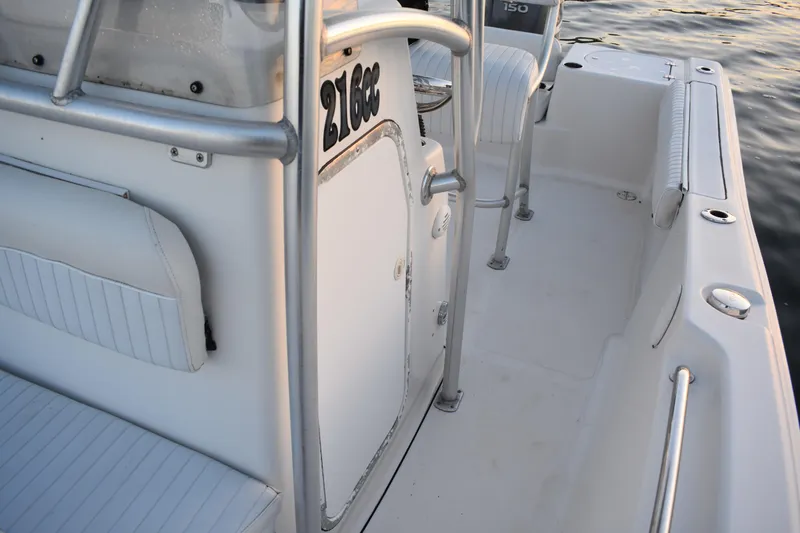 Slide: The Image of 2007 Tidewater 216 CC Adventure boat interior with seating and railing details. - 14