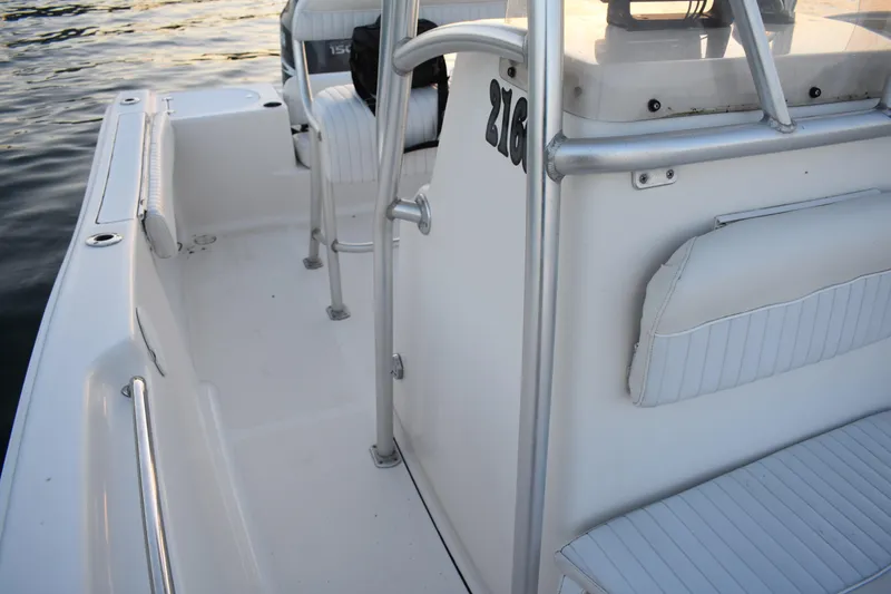 Slide: The Image of 2007 Tidewater 216 CC Adventure boat interior with seating and railing details. - 15