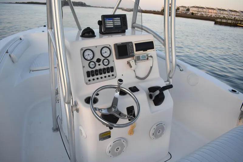 Slide: The Image of 2007 Tidewater 216 CC Adventure boat dashboard with steering wheel and navigation instruments. - 20