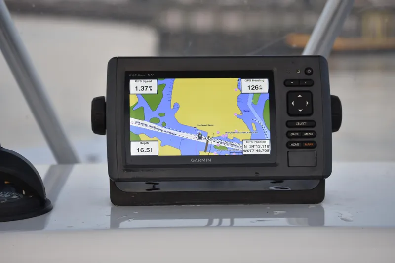 Slide: The Image of Garmin GPS device on 2007 Tidewater 216 CC Adventure boat, displaying navigation map. - 21