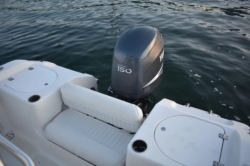 Slide: The Image of 2007 Tidewater 216 CC Adventure boat with Yamaha 150 outboard motor on water. - 22