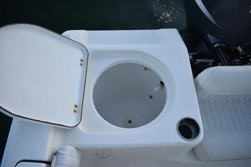 Slide: The Image of Livewell on 2007 Tidewater 216 CC Adventure boat, open lid, white seating. - 24
