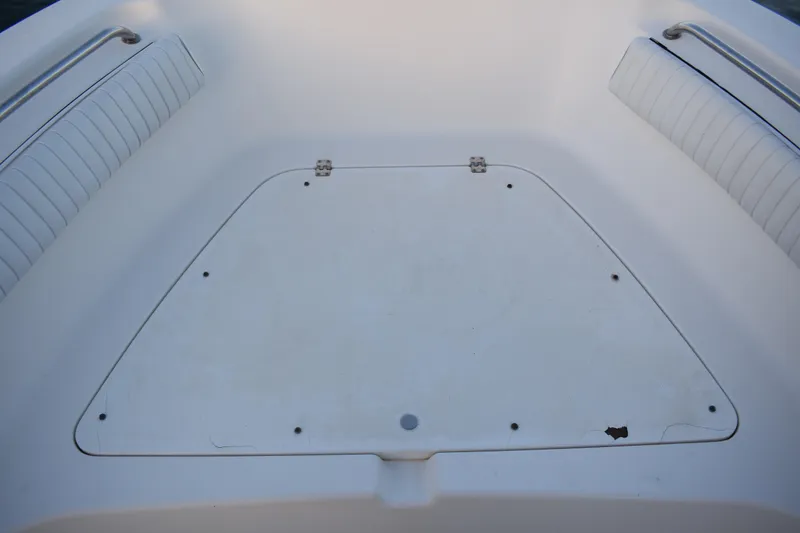 Slide: The Image of 2007 Tidewater 216 CC Adventure boat interior with storage compartment and seating. - 7