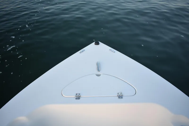 Slide: The Image of Bow of 2007 Tidewater 216 CC Adventure boat on calm water. - 9