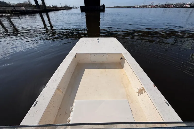 Slide: The Image of 2005 Jones Brothers Bateau 20 boat on calm water, viewed from the deck. - 13