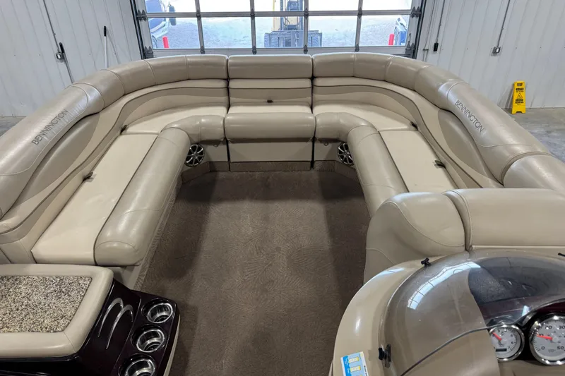 Slide: The Image of Luxurious interior of a 2010 Bennington 2250 RCW pontoon boat with plush seating. - 12