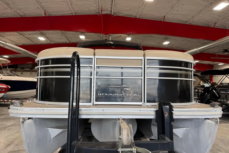 Slide: The Image of 2010 Bennington 2250 RCW pontoon boat in indoor storage facility. - 5