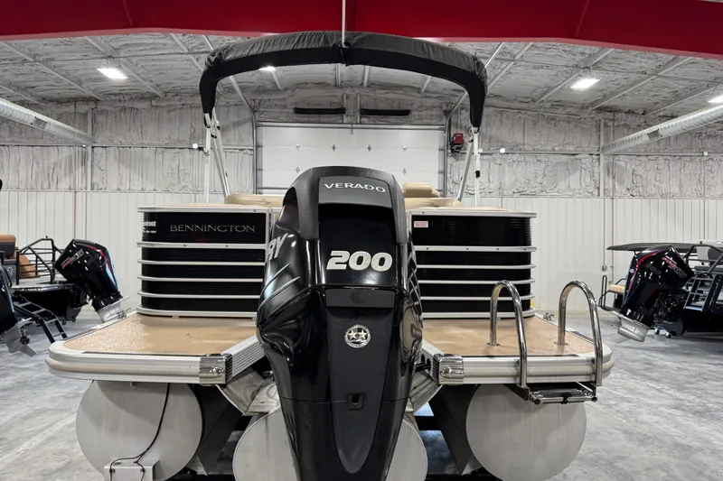 Slide: The Image of 2010 Bennington 2250 RCW pontoon boat with Mercury 200 Verado engine in a showroom. - 6