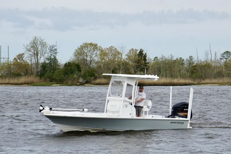 Slide: The Image of 2021 Sportsman Tournament 234 Bay Boat cruising on a scenic river. - 3