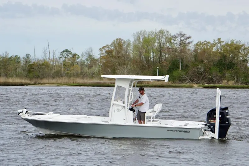 Slide: The Image of 2021 Sportsman Tournament 234 Bay Boat cruising on a scenic river. - 4