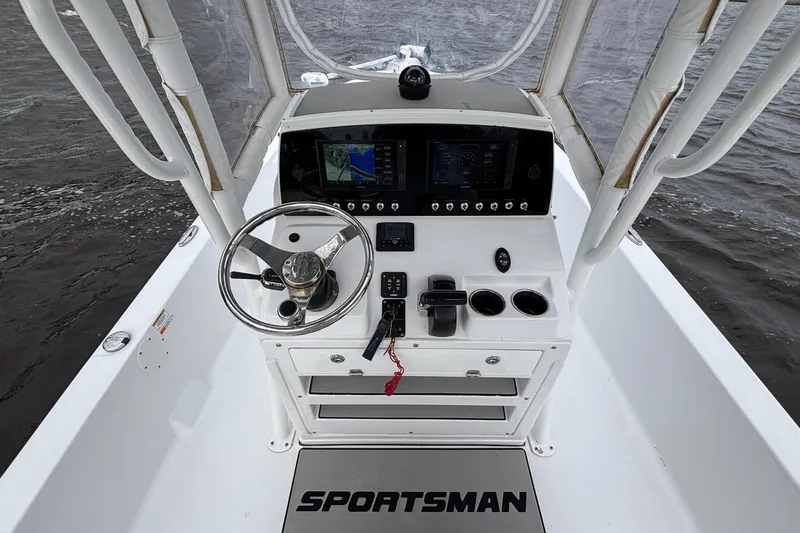 Slide: The Image of 2021 Sportsman Tournament 234 Bay Boat console with steering wheel and navigation display. - 7