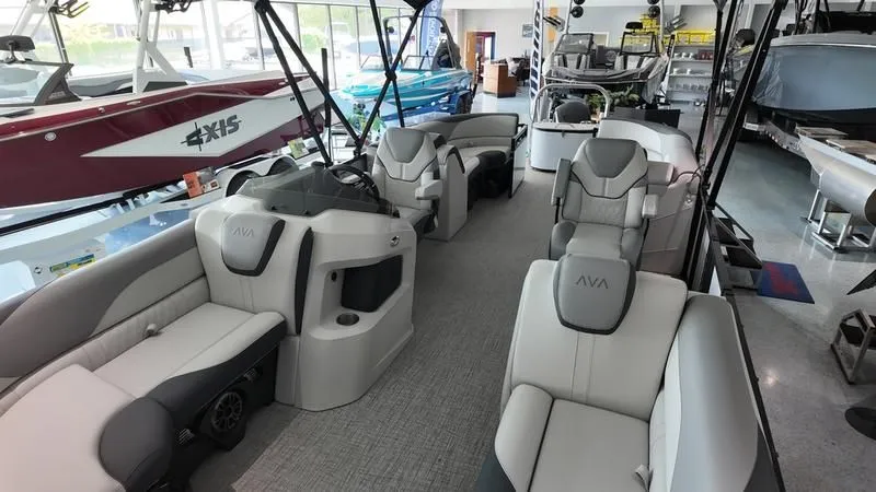 Slide: The Image of Interior of a 2025 Avalon LSZ pontoon boat in showroom. - 21