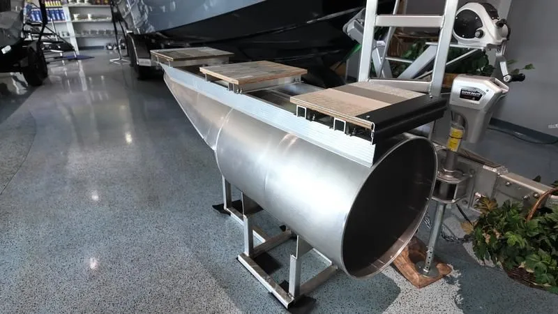 Slide: The Image of Avalon LSZ 2025 pontoon boat in showroom. - 27