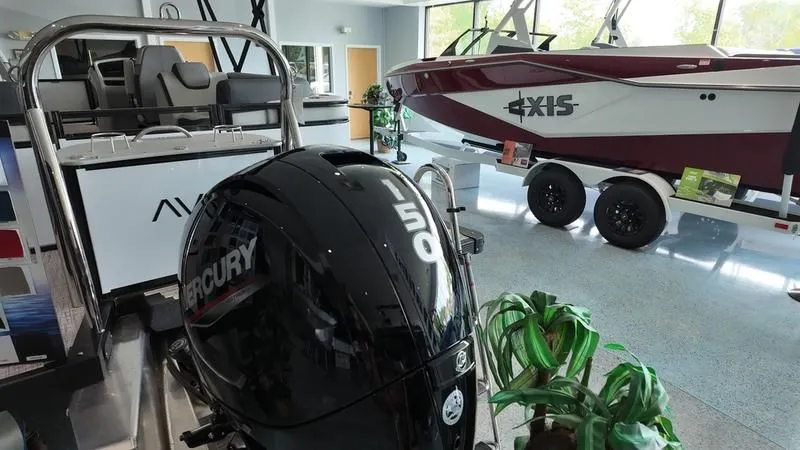 Slide: The Image of Avalon LSZ 2025 boat with Mercury engine in showroom. - 8