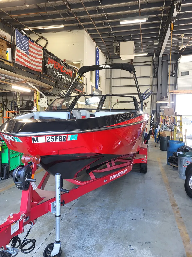 Slide: The Image of Red Axis T220 boat from 2025 in a workshop. - 3