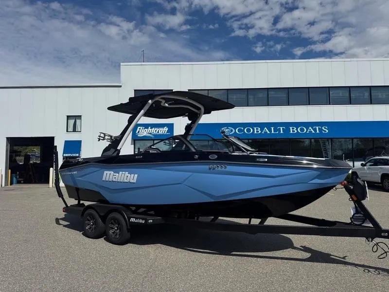 The Image of 2026 Malibu Wakesetter 22 LSV boat in front of Cobalt Boats building. - 1