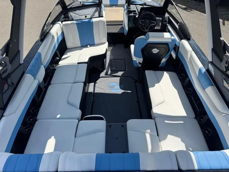 Slide: The Image of 2026 Malibu Wakesetter 22 LSV interior with blue and white seating. - 10