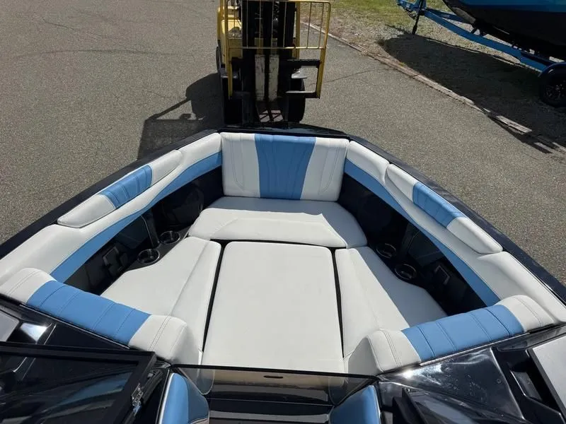 Slide: The Image of Interior of 2026 Malibu Wakesetter 22 LSV with blue and white seating. - 15