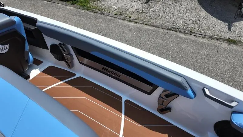 Slide: The Image of Interior of 2025 Malibu TXi with blue seats and wood flooring. - 11