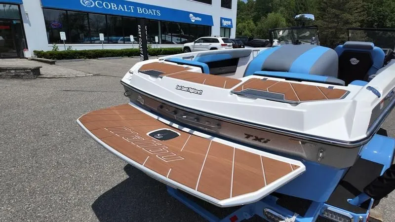 Slide: The Image of 2025 Malibu TXi boat at Cobalt Boats dealership. - 17