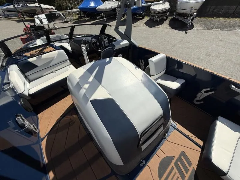 Slide: The Image of Interior of a 2024 Malibu TXi boat with modern seating. - 22