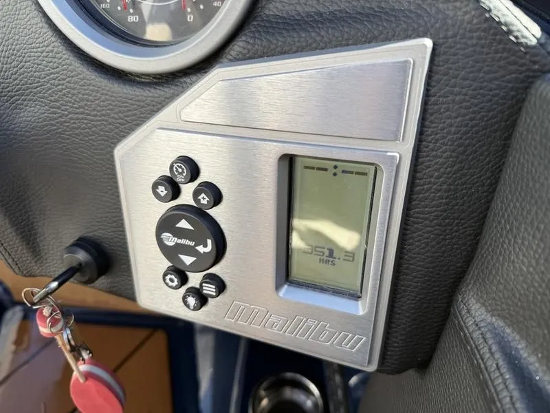 Slide: The Image of 2024 Malibu TXi dashboard with controls and display. - 27