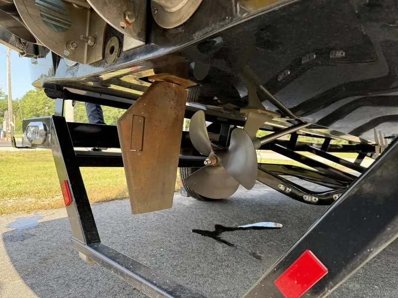 Slide: The Image of Underside of a 2022 Malibu TXi with propeller and rudder. - 11