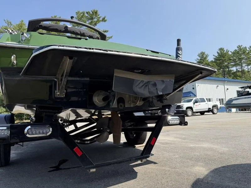 Slide: The Image of Malibu TXi 2022 boat on trailer, rear view outdoors. - 12