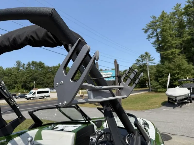 Slide: The Image of Malibu TXi 2022 boat with wakeboard rack outdoors. - 19