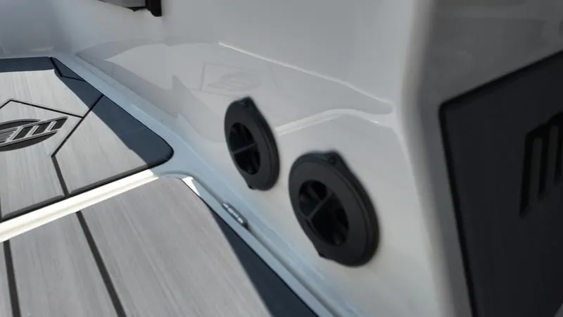 Slide: The Image of Close-up of 2025 Malibu TXi boat deck with air vents. - 11