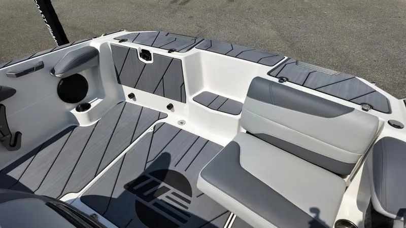 Slide: The Image of Interior of 2025 Malibu TXi with gray seating and flooring. - 15