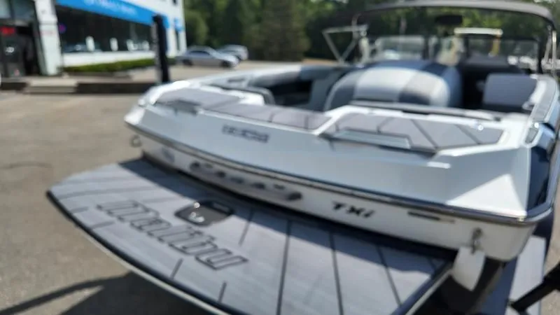 Slide: The Image of 2025 Malibu TXi boat parked, rear view. - 23