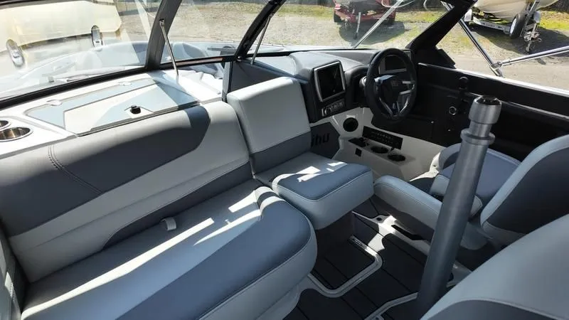 Slide: The Image of Interior of 2025 Malibu TXi with modern seating and control console. - 24