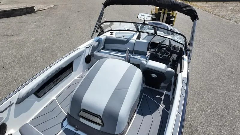 Slide: The Image of Interior view of 2025 Malibu TXi boat with gray seating. - 31